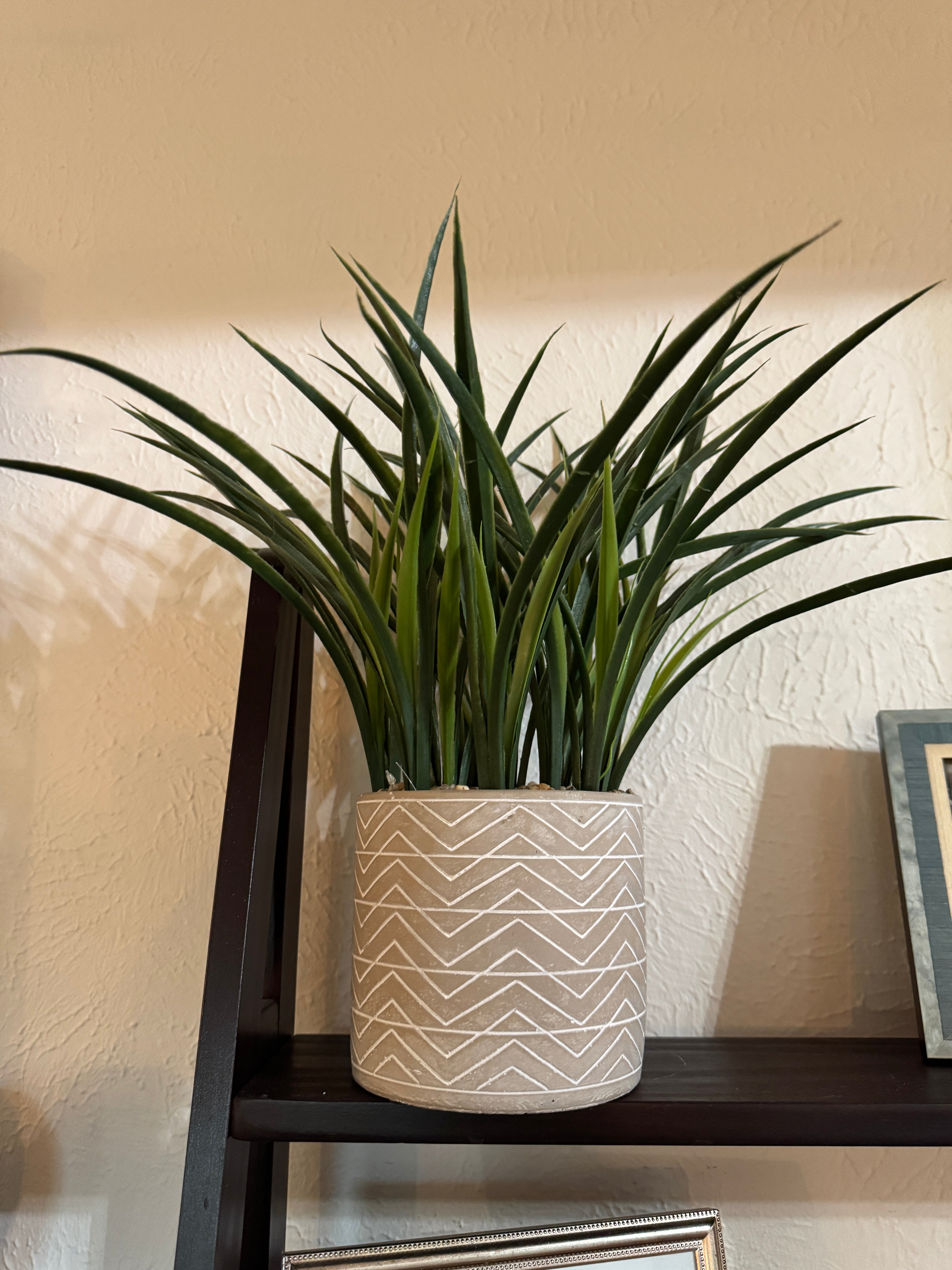 Faux plant in gray pot