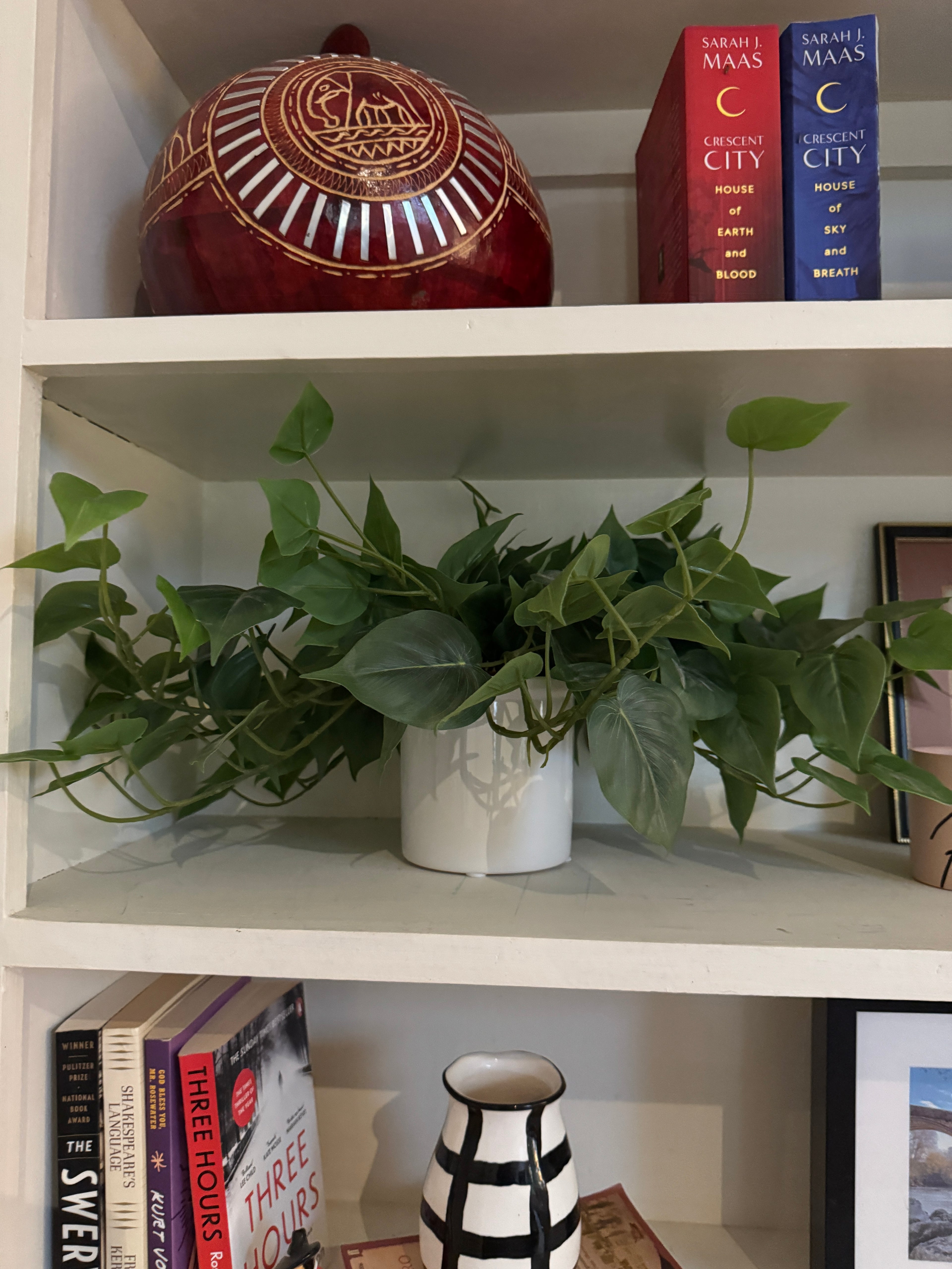 Faux plant in white pot